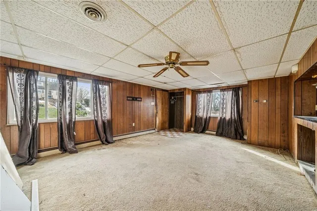 a view of an empty room with a fireplace