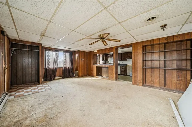 a view of an empty room with closet