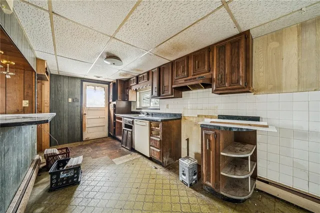 a kitchen with stainless steel appliances granite countertop a stove sink and cabinets