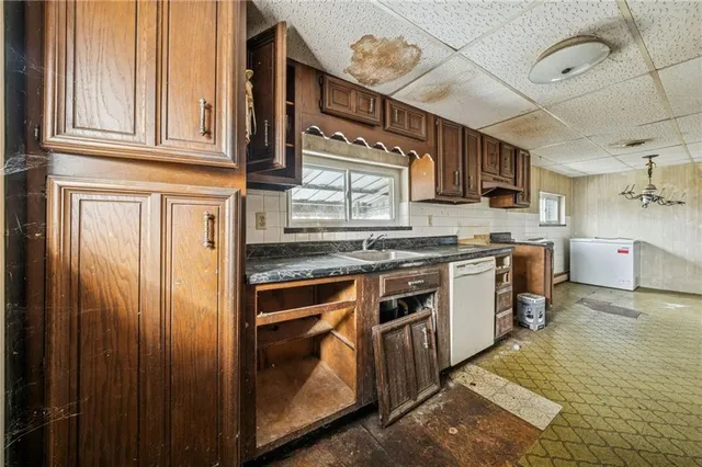 a kitchen with stainless steel appliances granite countertop a stove and a sink