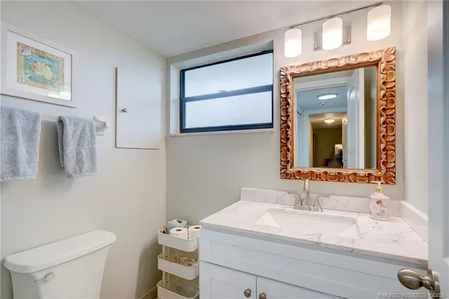 a view of a hallway with chairs