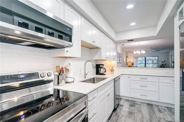 a dining room with furniture and a window