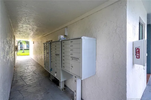 a bathroom with a granite countertop sink mirror vanity and toilet