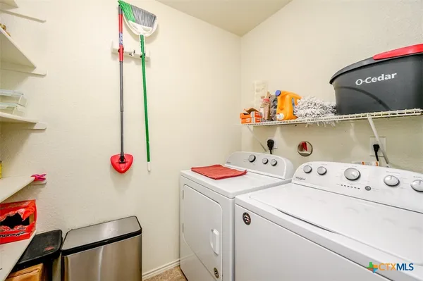 a utility room with dryer and washer