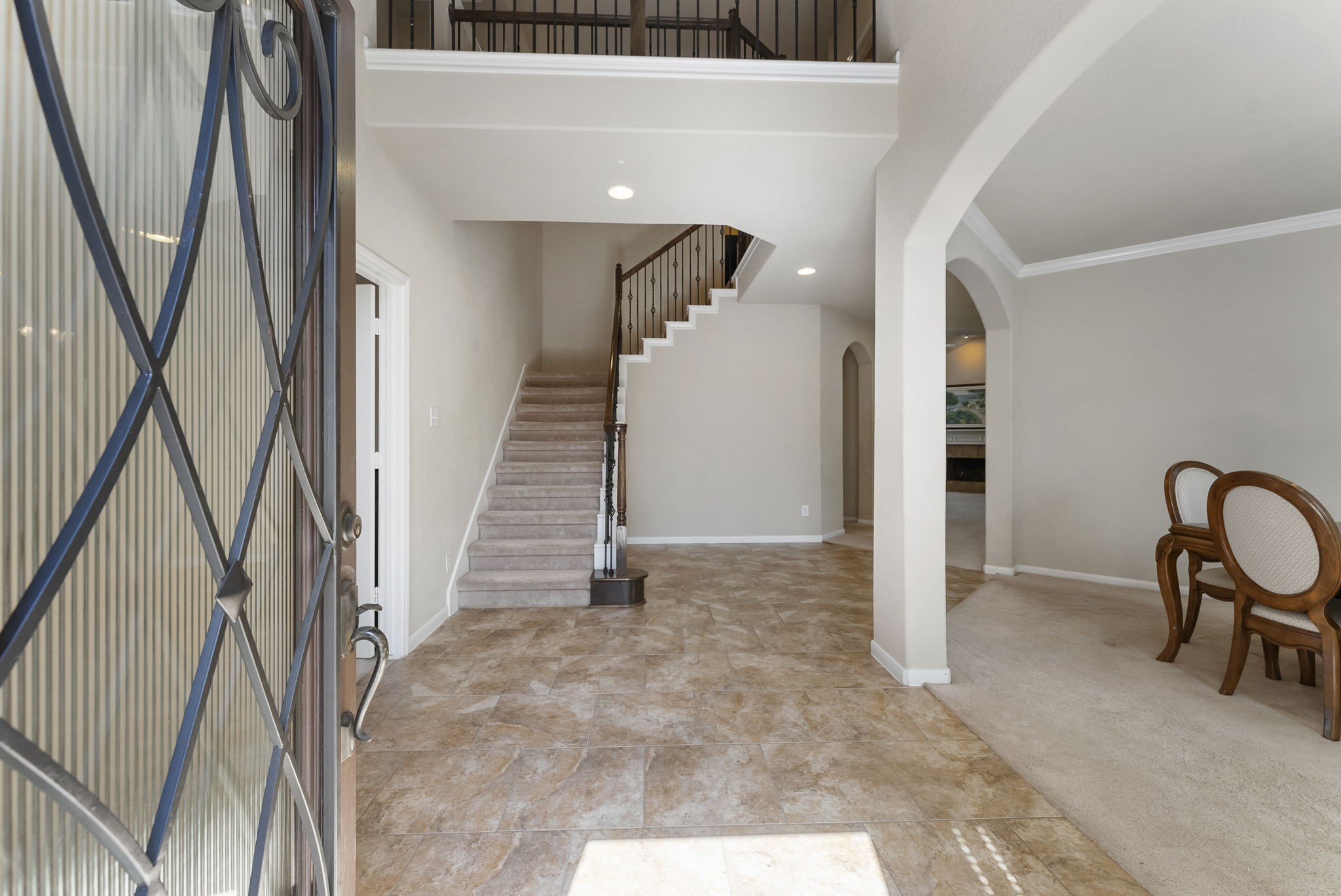 19223 Senterra Lakes Boulevard Spring, TX 77379 - Photo 7 of 48 a view of a hallway with a couch and stairs