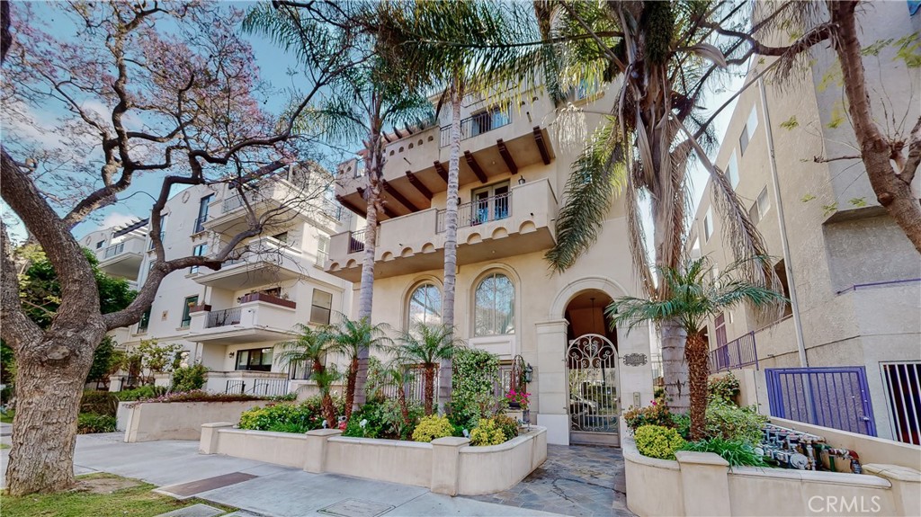 1544 Camden Avenue, Unit PH1 Los Angeles, CA 90025 - Photo 1 of 23 a front view of a house with yard