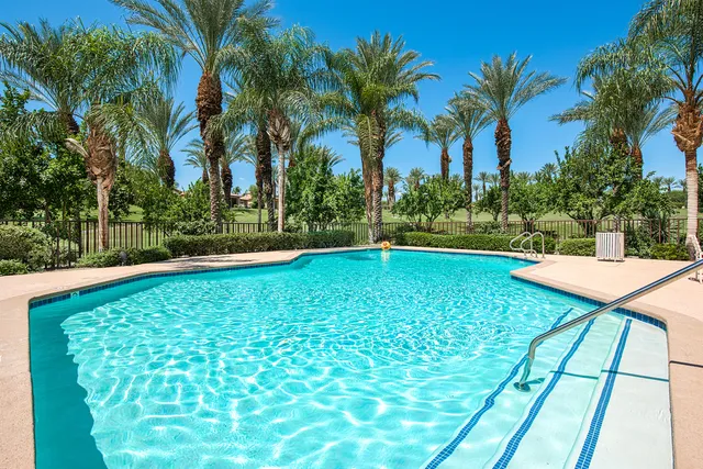 a utility room with cabinets washer and dryer