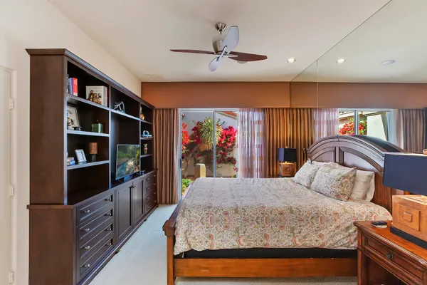 a kitchen with stainless steel appliances kitchen island granite countertop a refrigerator and a stove