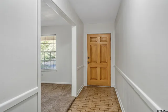 a view of hallway with windows