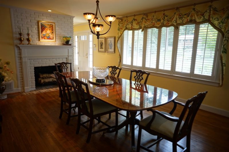 3621 Dade Street Raleigh, NC 27612 - Photo 4 of 23 The Living Room, features gorgeous hardwood floors, a masonry fireplace and plantation shutters. Living Room