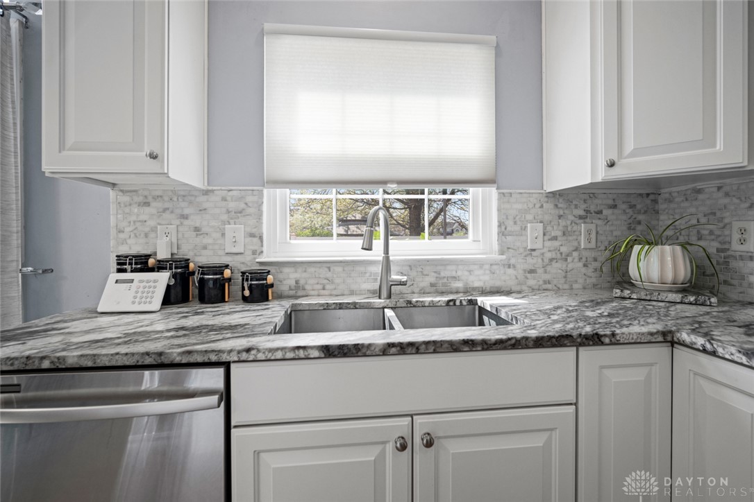 55 Janney Lane Springboro, OH 45066 - Photo 5 of 38 This bright kitchen features sleek appliances and elegant countertops, offering a fresh culinary space.