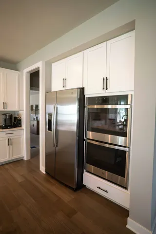 a view of a dining room with furniture and window