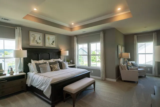 a bedroom with bed and a night stand