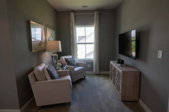 a living room with furniture and a window