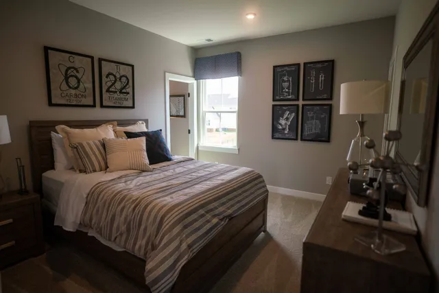 a bathroom with double vanity sinks and a mirror