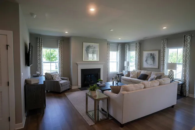 a large kitchen with a table and chairs