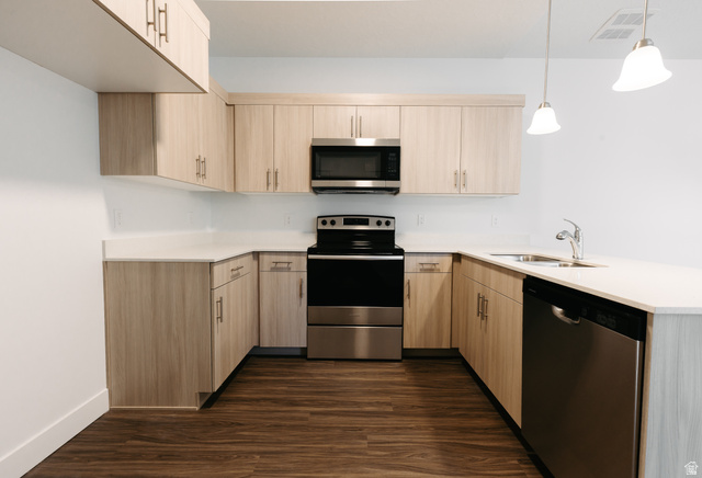 4655 South 720 West, Unit I304 Mapleton, UT 84664 - Photo 11 of 16 Kitchen with stainless steel appliances, a peninsula, pendant lighting, and light wood finish cabinetry