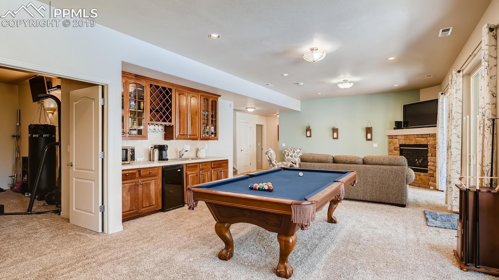 4061 High Forest Road Colorado Springs, CO 80908 - Photo 24 of 40 Finished walk-out lower level with wet bar...