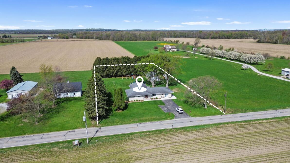 an aerial view of a golf course with an ocean view