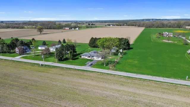 a view of a lake with a house in the background