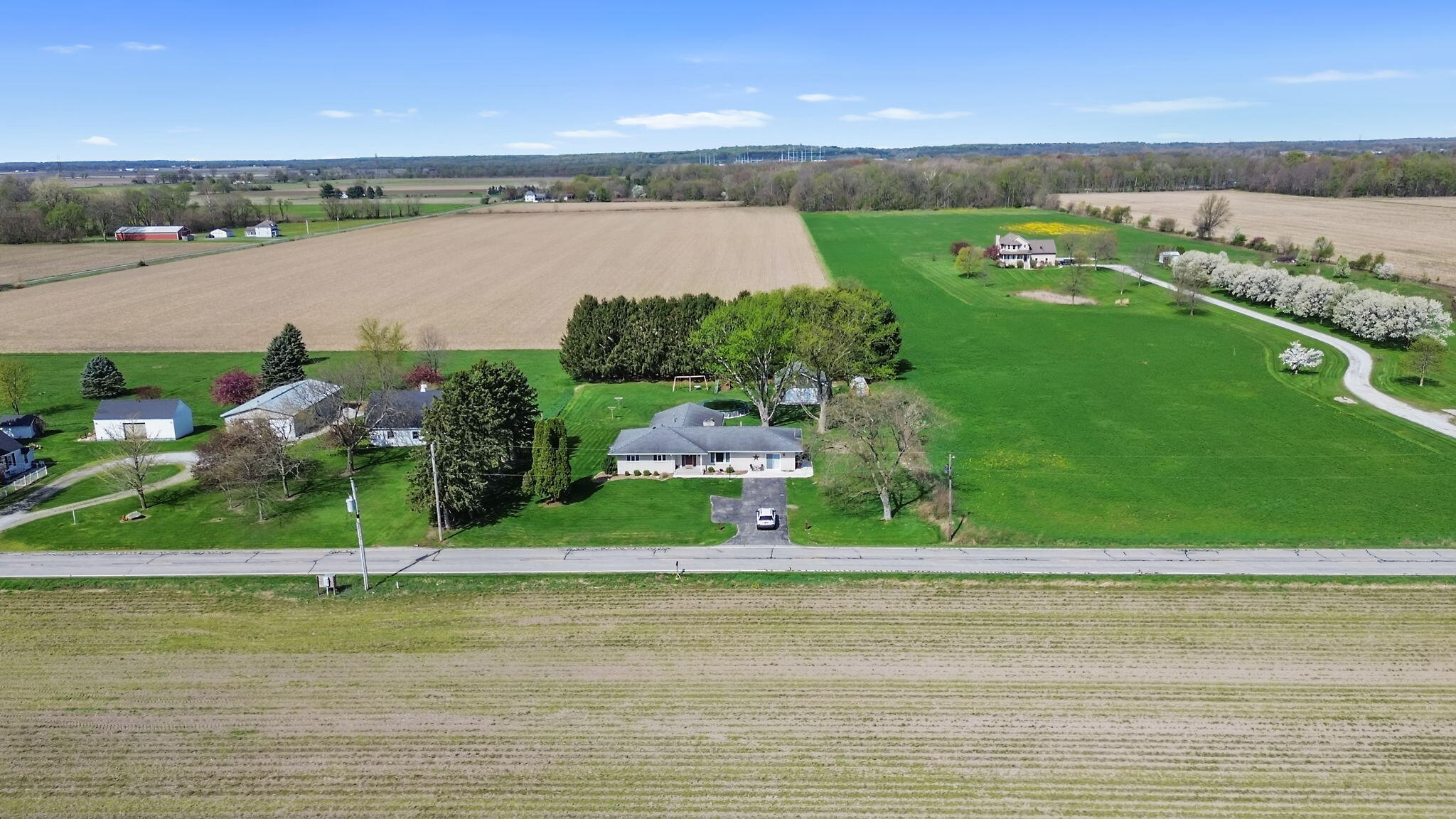 56915 Tulip Road New Carlisle, IN 46552 - Photo 14 of 19 a view of a lake with a house in the background
