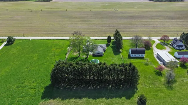 a view of a garden with lawn chairs