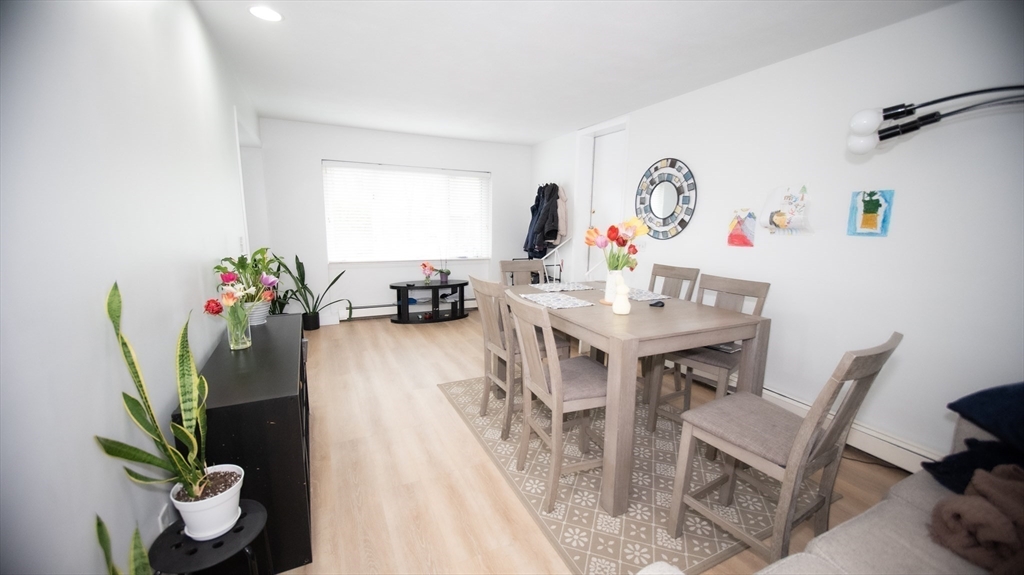 25 Fraser Road Framingham, MA 01702 - Photo 15 of 21 a view of a dining room with furniture and a potted plant