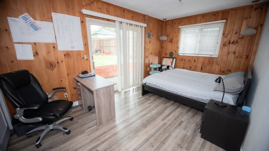 25 Fraser Road Framingham, MA 01702 - Photo 17 of 21 a bedroom with a bed and wooden floor