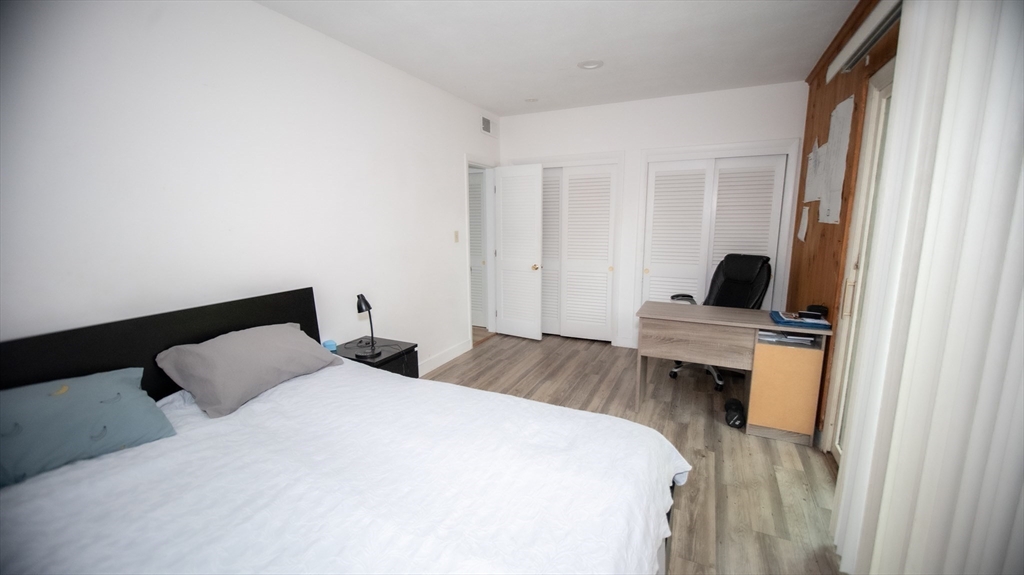 25 Fraser Road Framingham, MA 01702 - Photo 18 of 21 a bedroom with a bed and a flat screen tv