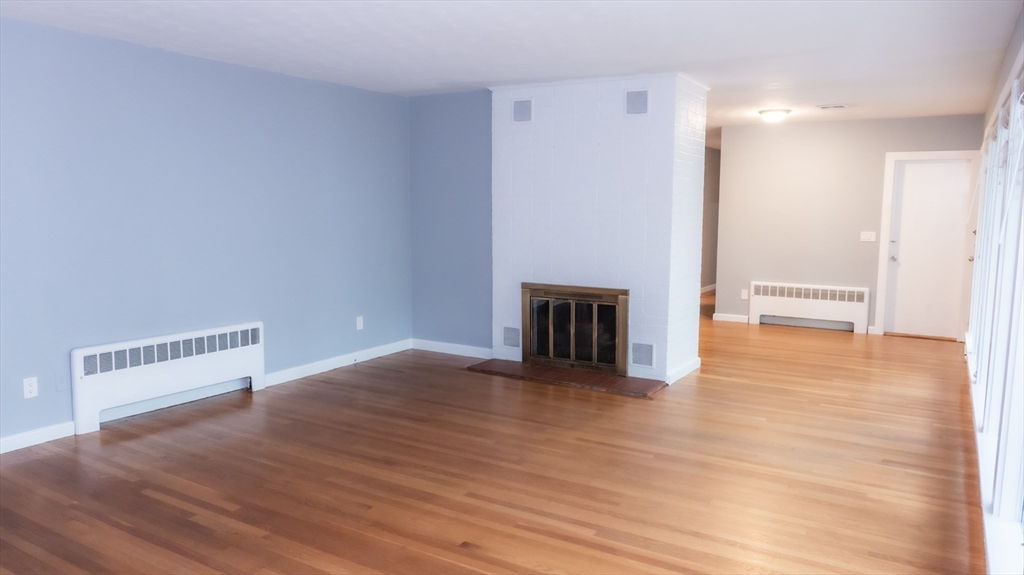 25 Fraser Road Framingham, MA 01702 - Photo 5 of 21 a view of empty room with wooden floor