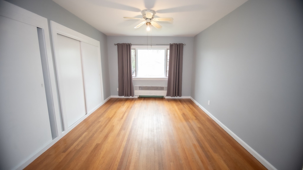 25 Fraser Road Framingham, MA 01702 - Photo 7 of 21 wooden floor in an empty room with a window