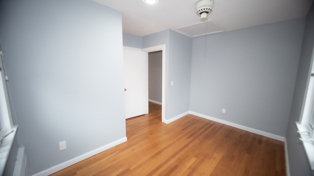 25 Fraser Road Framingham, MA 01702 - Photo 8 of 21 a view of empty room with wooden floor