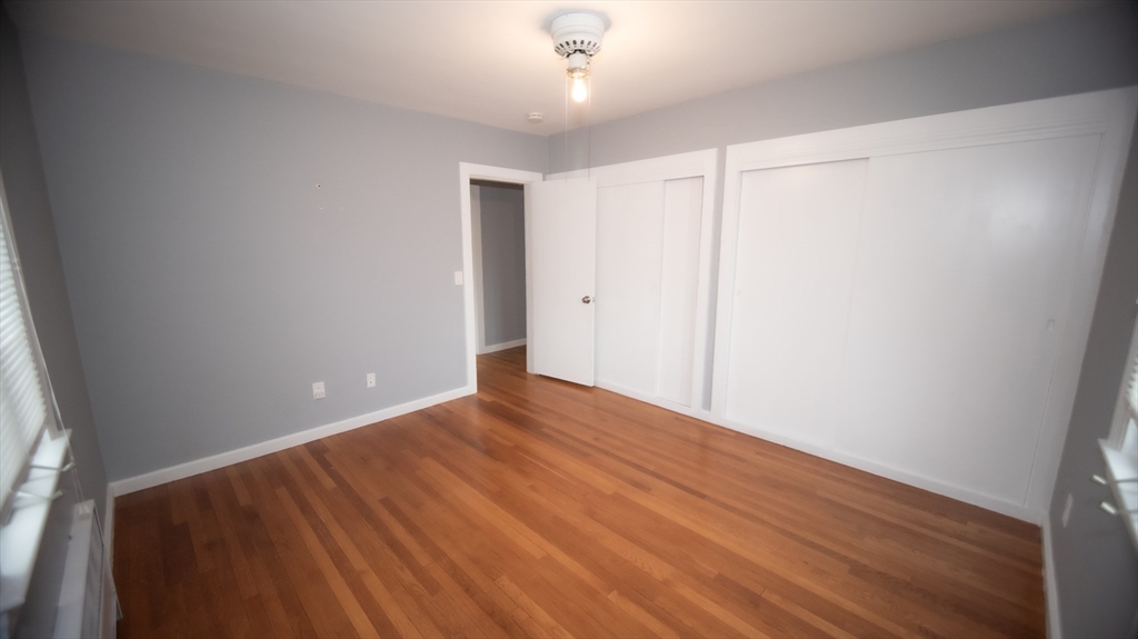 25 Fraser Road Framingham, MA 01702 - Photo 9 of 21 a view of an empty room with wooden floor