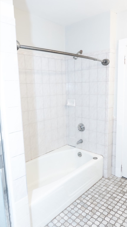 25 Fraser Road Framingham, MA 01702 - Photo 10 of 21 a bathroom with a bathtub and a shower