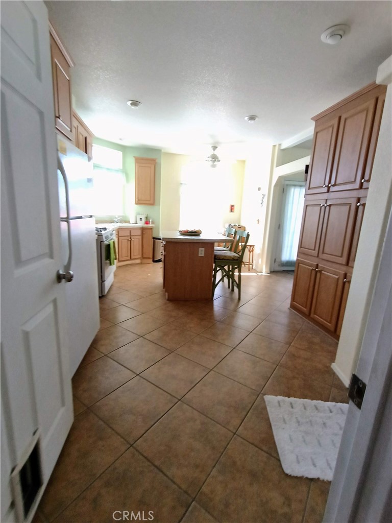 17640 Corkill Road, Unit 40 Desert Hot Springs, CA 92241 - Photo 4 of 55 View into large kitchen