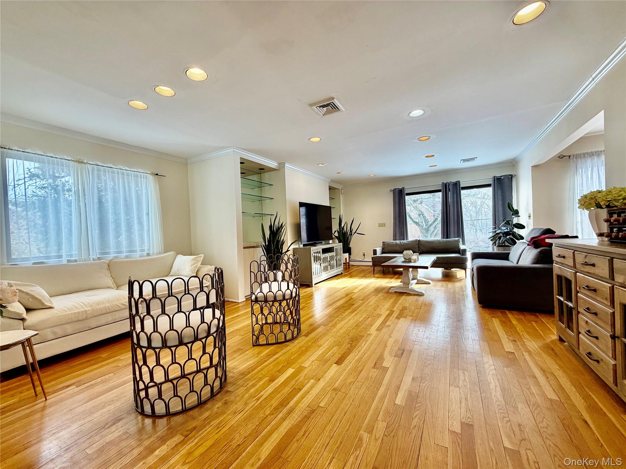 75 Greenway Close, Unit 1 Rye Brook, NY 10573 - Photo 21 of 24 a living room with furniture fireplace and a table
