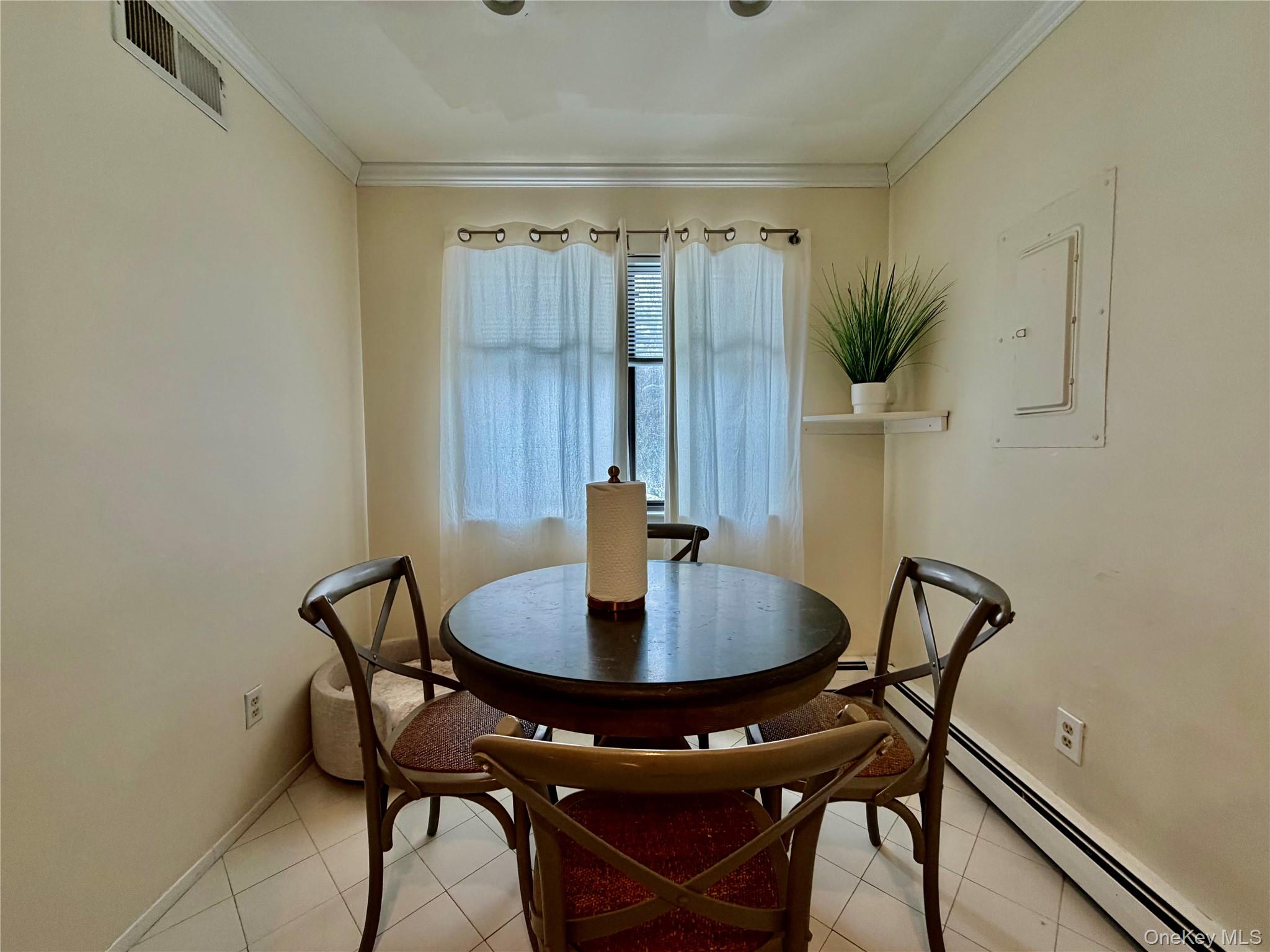 75 Greenway Close, Unit 1 Rye Brook, NY 10573 - Photo 23 of 24 a view of a dining room with furniture and wooden floor