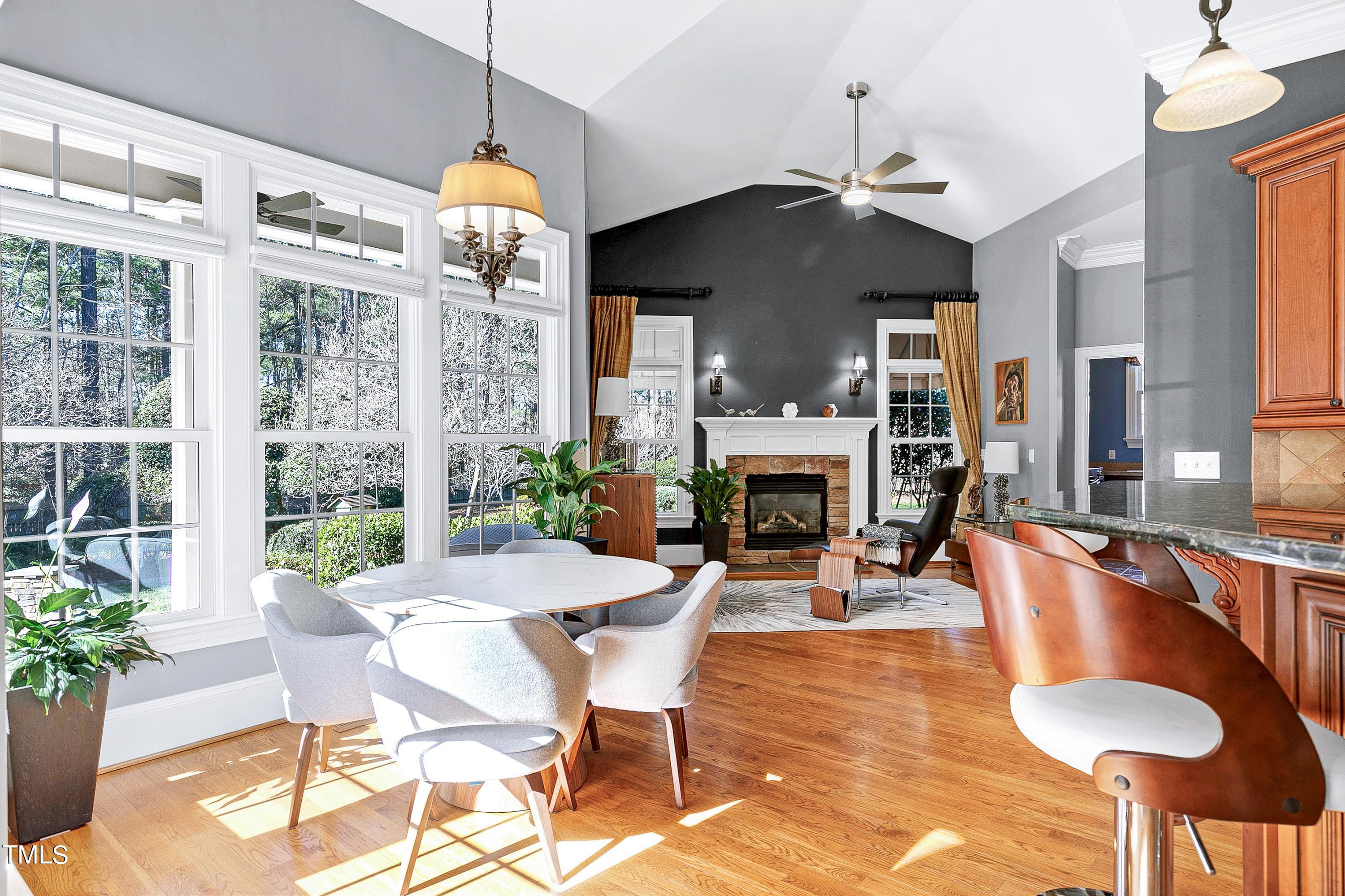2912 Ryton Court Raleigh, NC 27613 - Photo 17 of 86 a dining room with furniture a chandelier and wooden floor