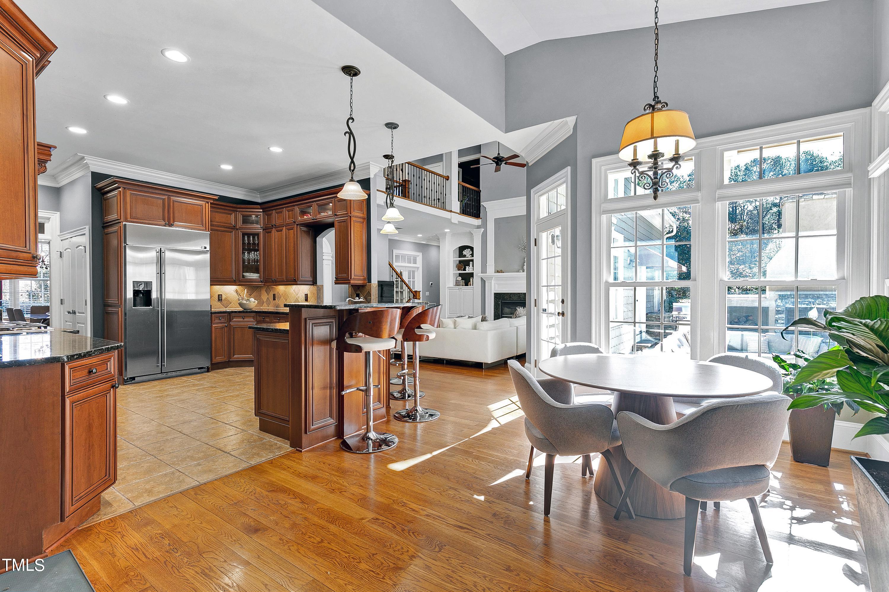 2912 Ryton Court Raleigh, NC 27613 - Photo 20 of 86 a dining room filled with furniture and a chandelier
