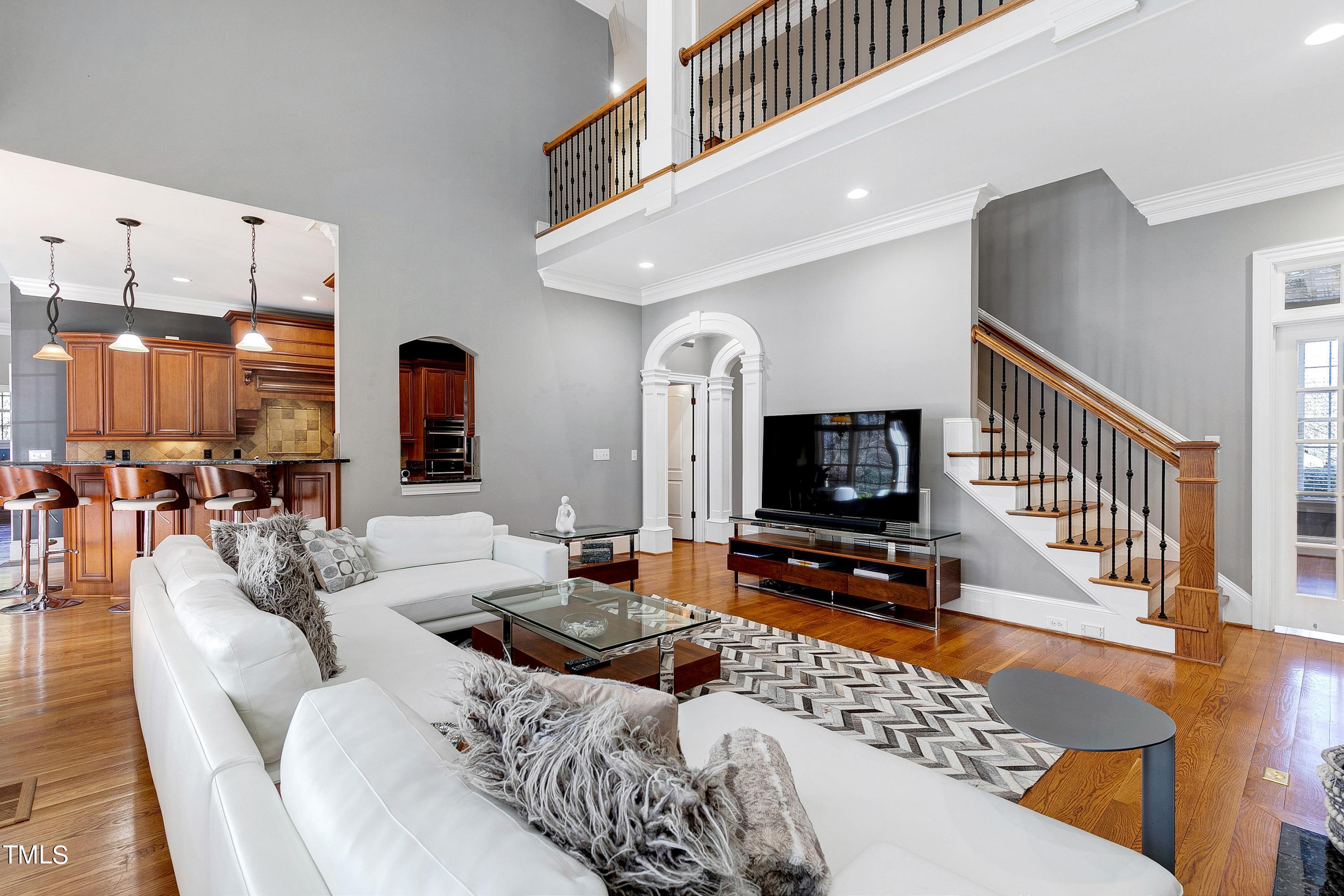 2912 Ryton Court Raleigh, NC 27613 - Photo 27 of 86 a living room with furniture and a flat screen tv
