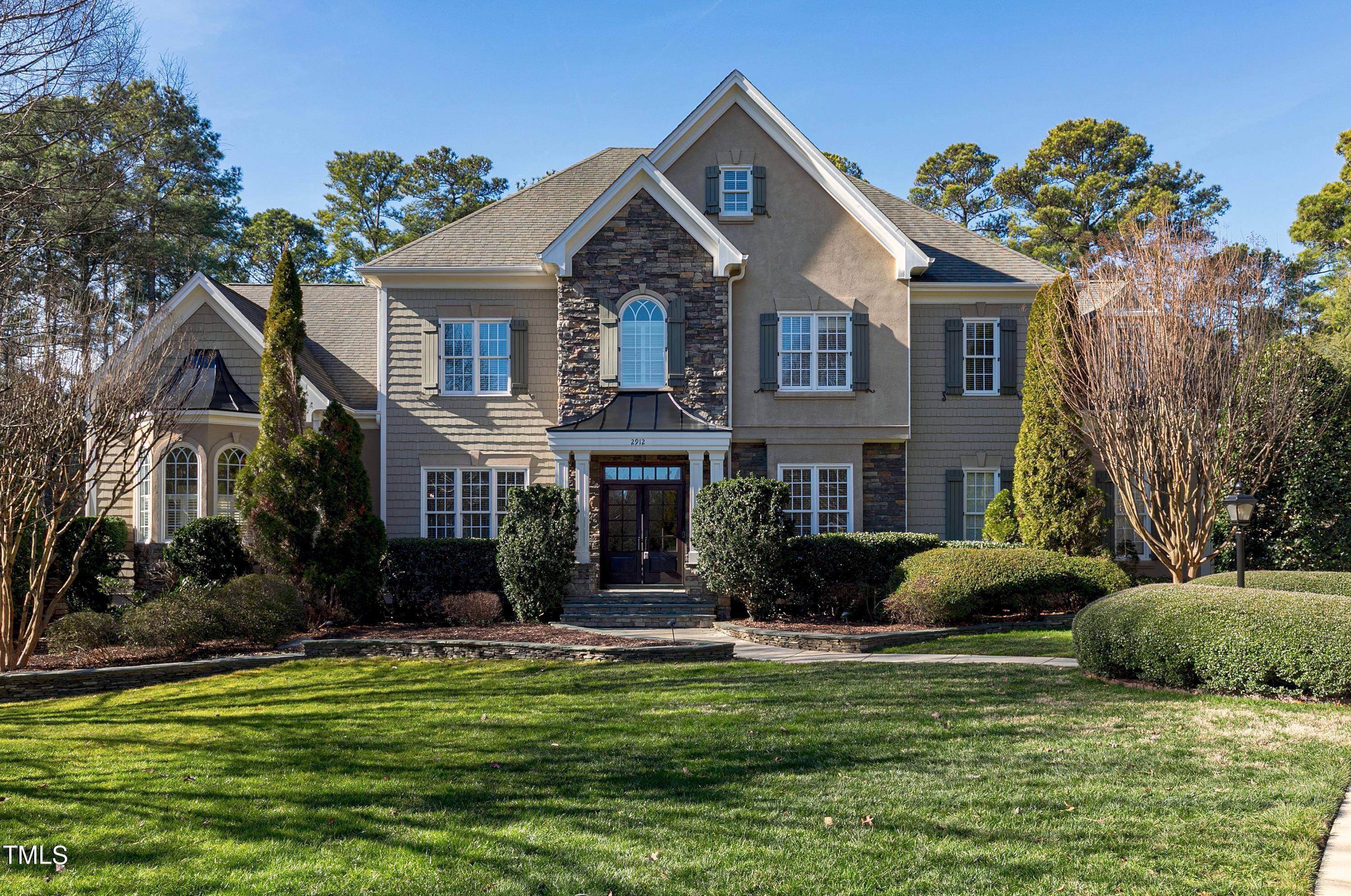 2912 Ryton Court Raleigh, NC 27613 - Photo 3 of 86 a front view of a house with a garden