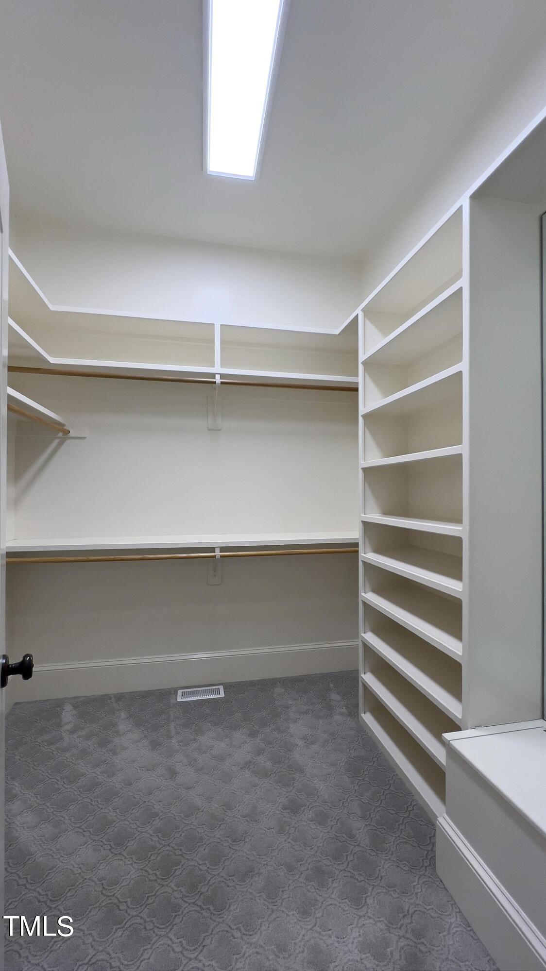 2912 Ryton Court Raleigh, NC 27613 - Photo 35 of 86 a view of walk in closet with empty racks