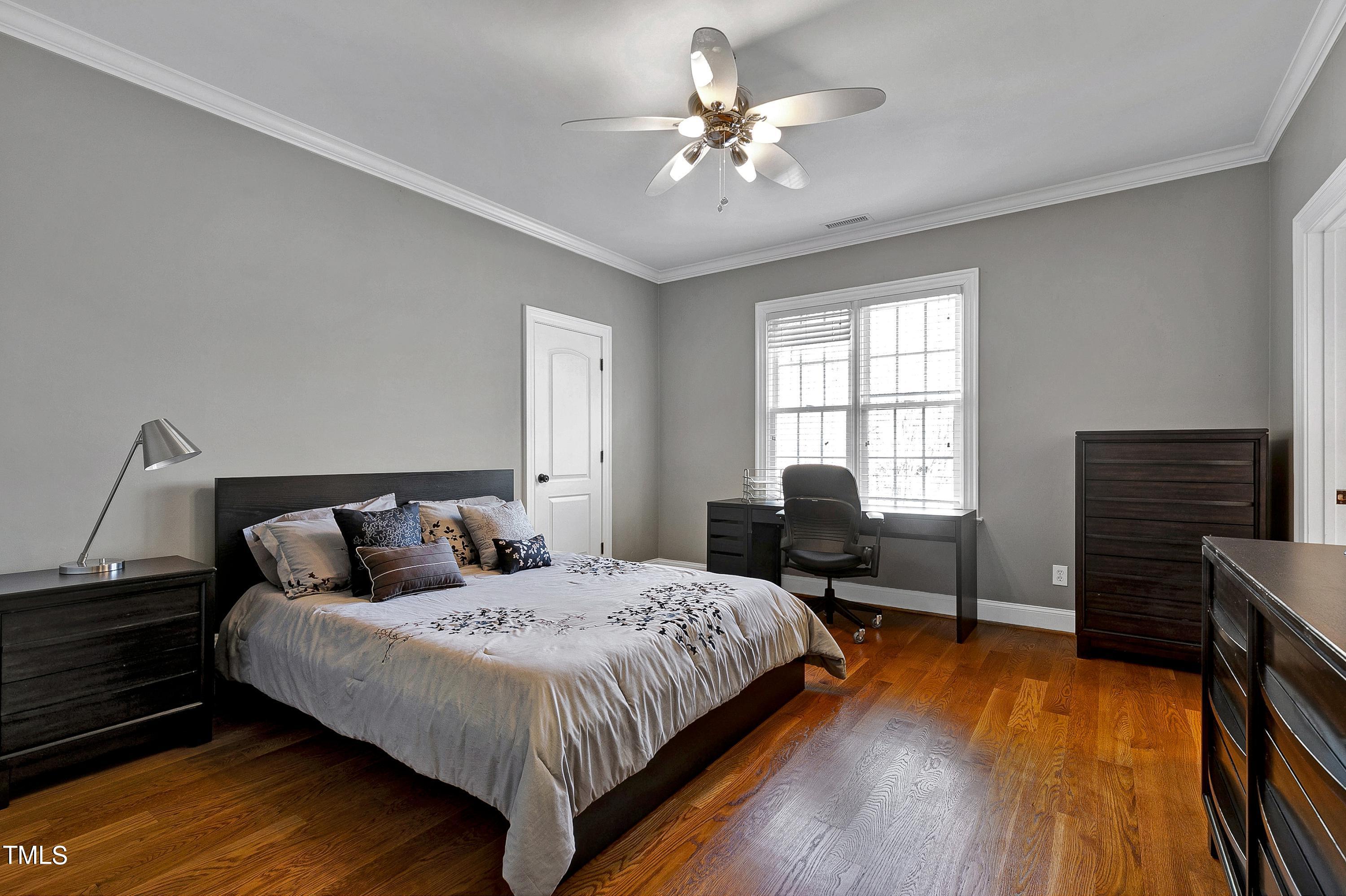 2912 Ryton Court Raleigh, NC 27613 - Photo 53 of 86 a bedroom with a bed windows and a chair