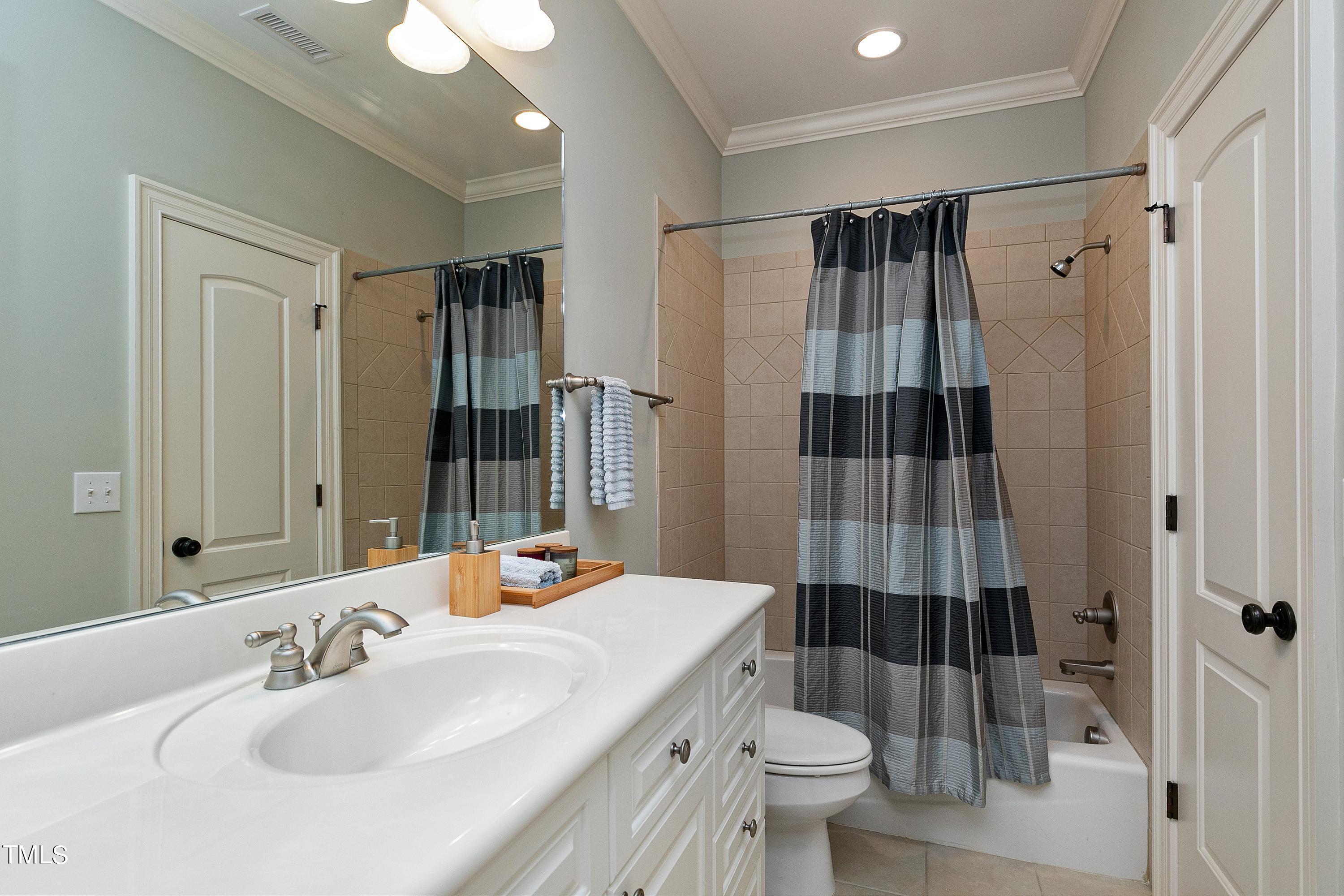 2912 Ryton Court Raleigh, NC 27613 - Photo 54 of 86 a bathroom with a sink toilet and shower