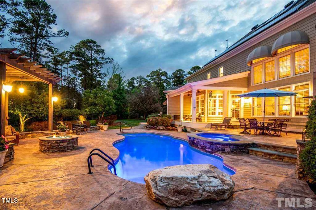 2912 Ryton Court Raleigh, NC 27613 - Photo 63 of 86 a swimming pool with outdoor seating and yard