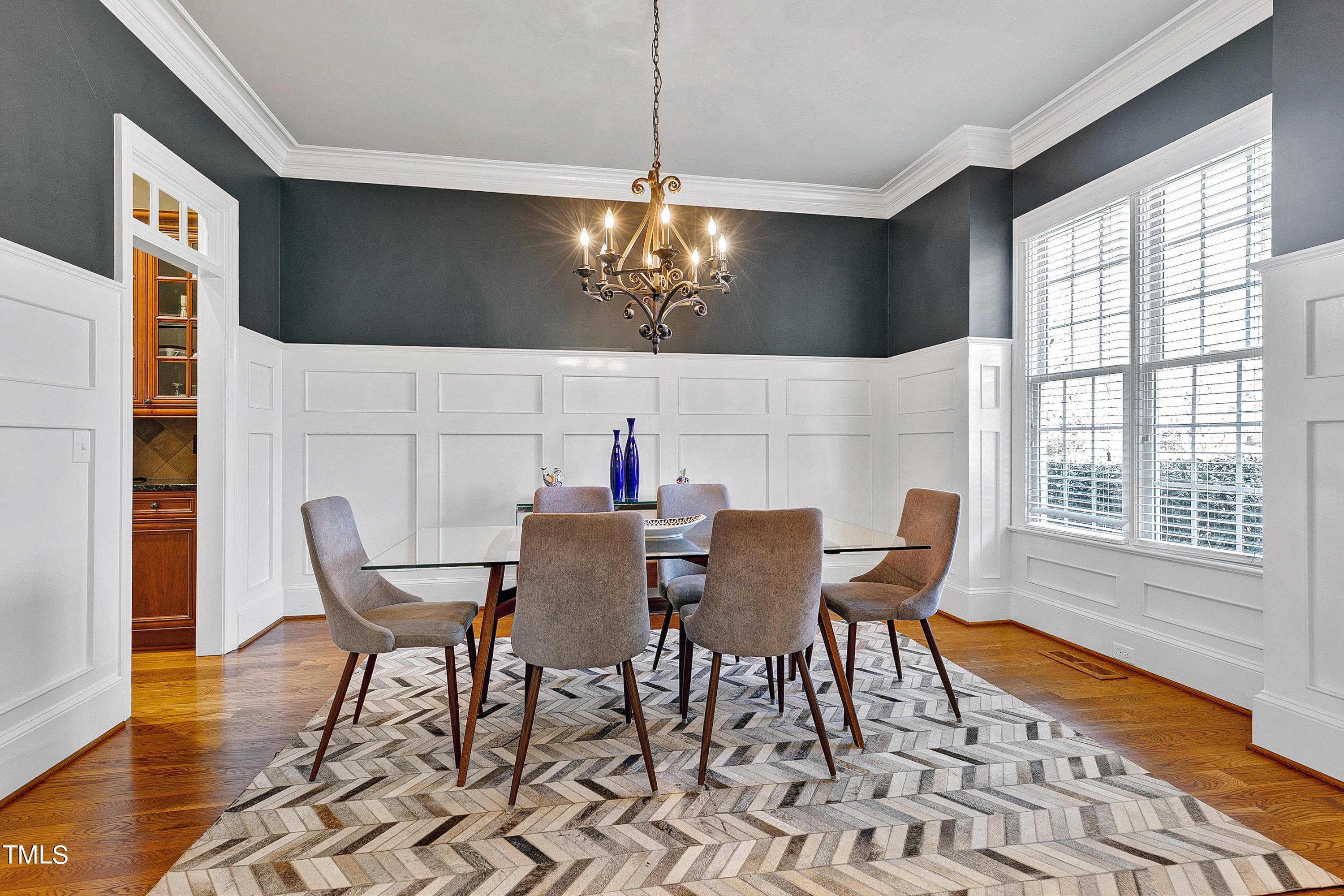 2912 Ryton Court Raleigh, NC 27613 - Photo 7 of 86 a view of a dining room with furniture and wooden floor