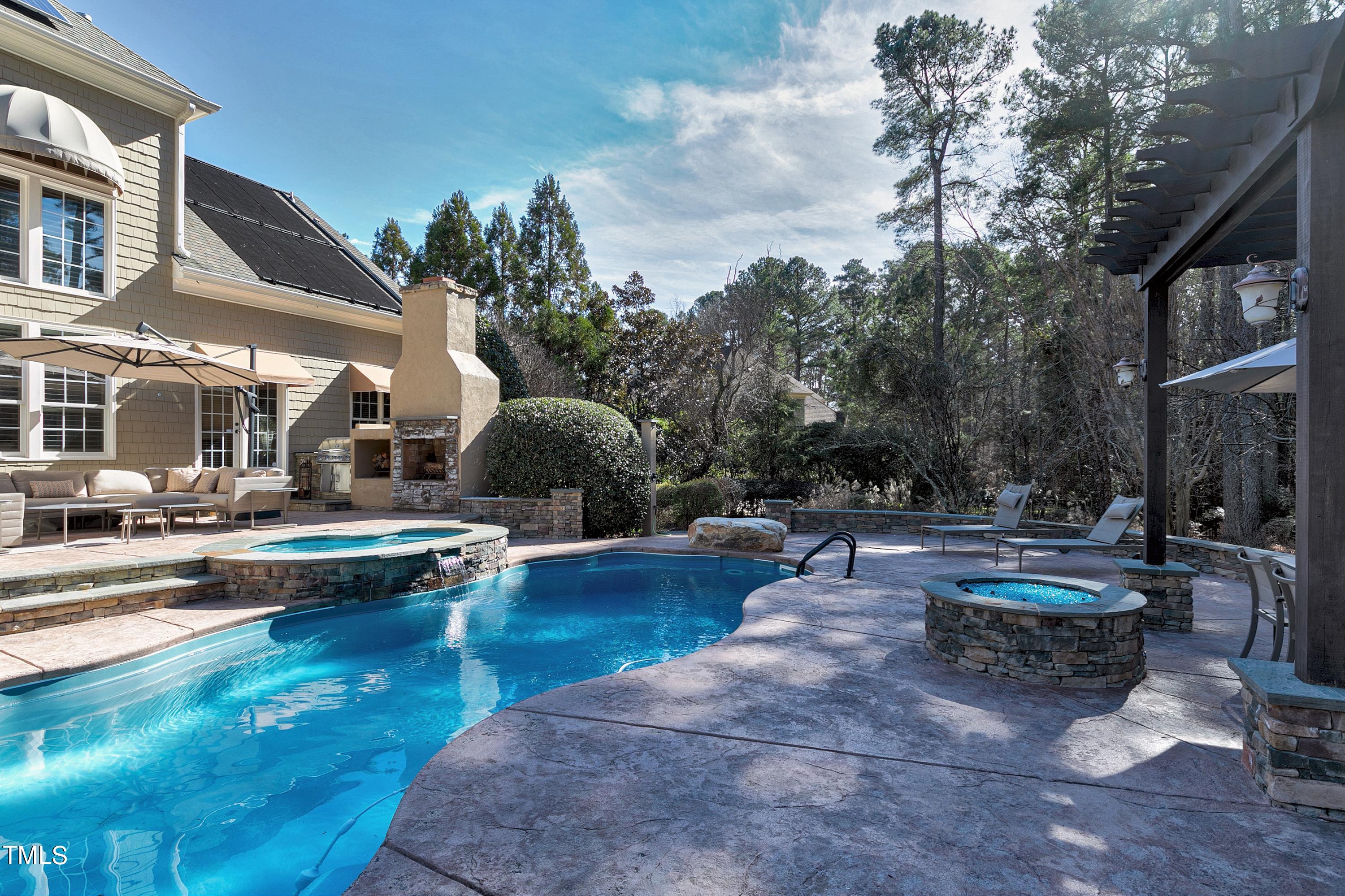 2912 Ryton Court Raleigh, NC 27613 - Photo 72 of 86 a swimming pool with outdoor seating and plants