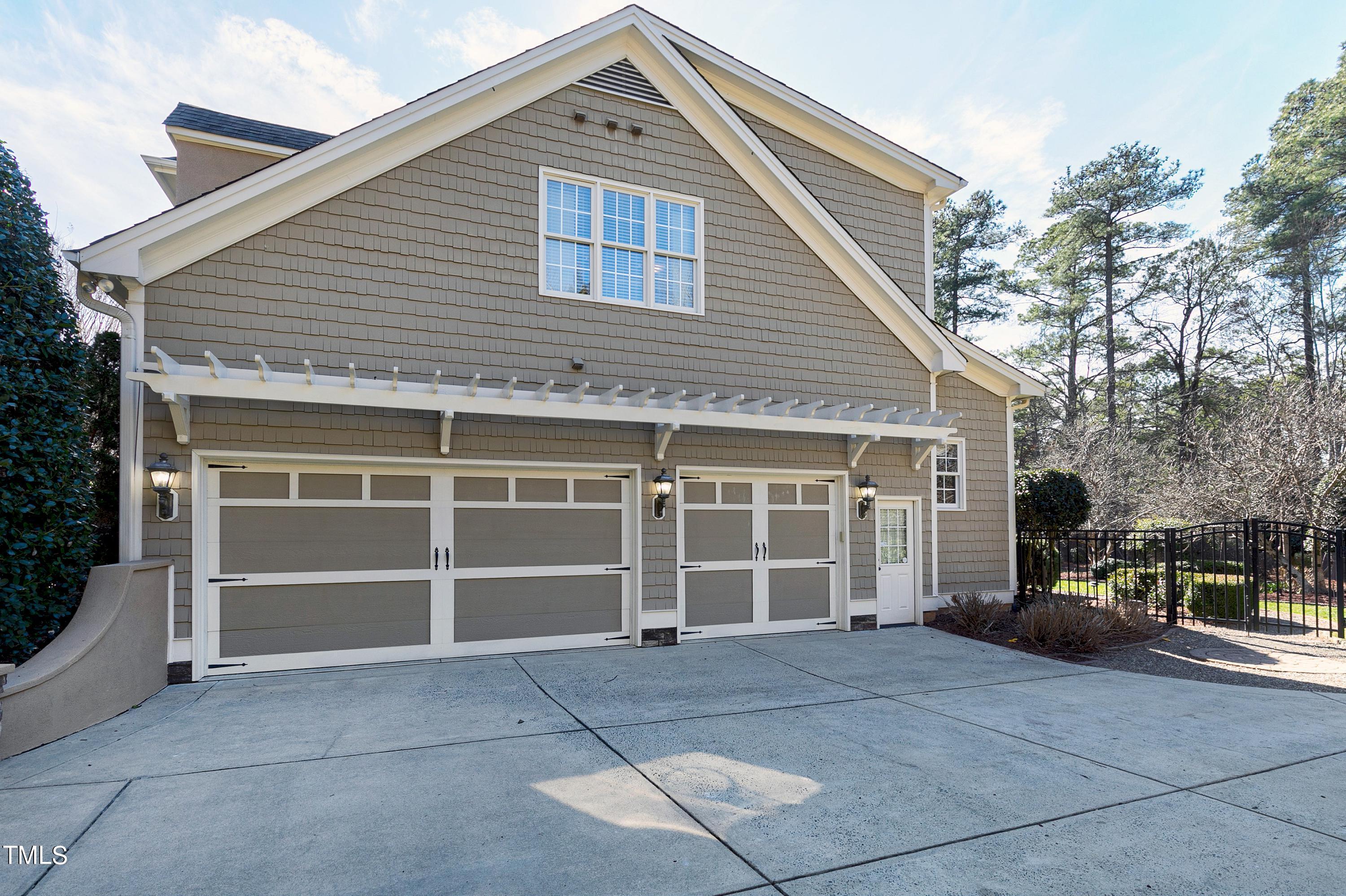 2912 Ryton Court Raleigh, NC 27613 - Photo 78 of 86 a front view of a house with a yard and garage
