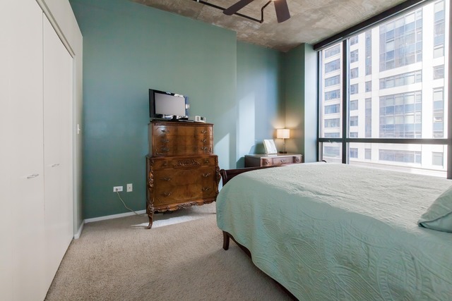 520 South State Street, Unit 501 Chicago, IL 60605 - Photo 15 of 25 a bedroom with a bed and a window