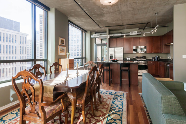 520 South State Street, Unit 501 Chicago, IL 60605 - Photo 8 of 25 a view of a dining room with furniture window and wooden floor